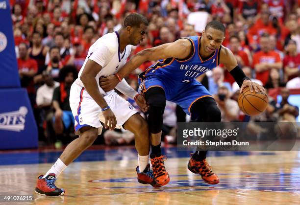 Russell Westbrook of the Oklahoma City Thunder drives against Chris Paul of the Los Angeles Clippers in Game Six of the Western Conference Semifinals...