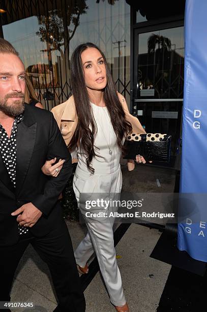 Photographer Brian Bowen Smith and actress Demi Moore attend the opening of The De Re Gallery on May 15, 2014 in Los Angeles, California.