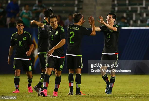 Marco Bueno of Mexico celebrates his second goal of the game against Costa Rica with teammate JoseCarlos Van Rankin in the second half during the...