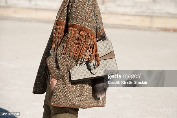 Fashion Blogger Nina Suess wears a Sport Max jacket, Agnona top, Citizens of Humanity trousers, and Gucci bag on day 4 during Paris Fashion Week...