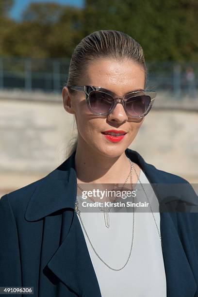 Fashion Blogger Dasha Gold wears a Bianca Spender coat, and Haati Chai and Crystal Eclipse jewellery on day 4 during Paris Fashion Week Spring/Summer...