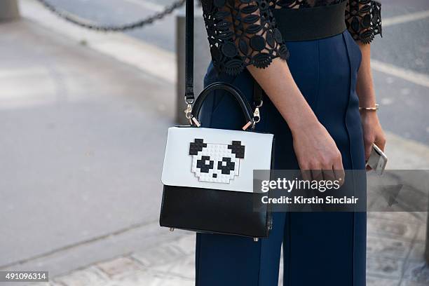 Fashion Blogger Maja Malnar wears a Self Portrait jumpsuit, and a Les Petit Joueurs bag on day 4 during Paris Fashion Week Spring/Summer 2016 on...