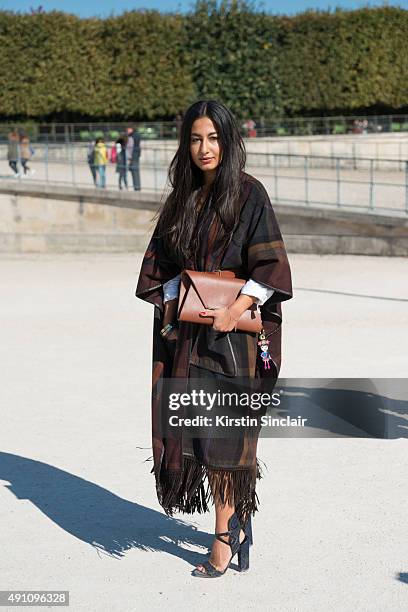 Fashion Writer Nausheen Shah wears a Jill Haber bag, Paul Andrew shoes, Etro dress and a Giulietta cape on day 4 during Paris Fashion Week...