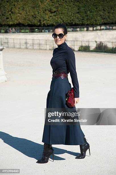 Fashion Blogger Mariah Maia wears a Delpozo dress, Alaia belt and shoes, Giorgio Armani bag and Thierry Lasry sunglasses on day 4 during Paris...