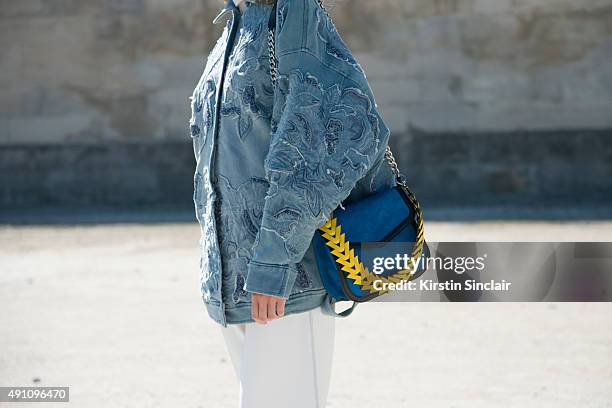 Fashion Blogger Helena Bordon wears an Espaco Fashion jacket, Printing trousers, and Loewe bag on day 4 during Paris Fashion Week Spring/Summer 2016...