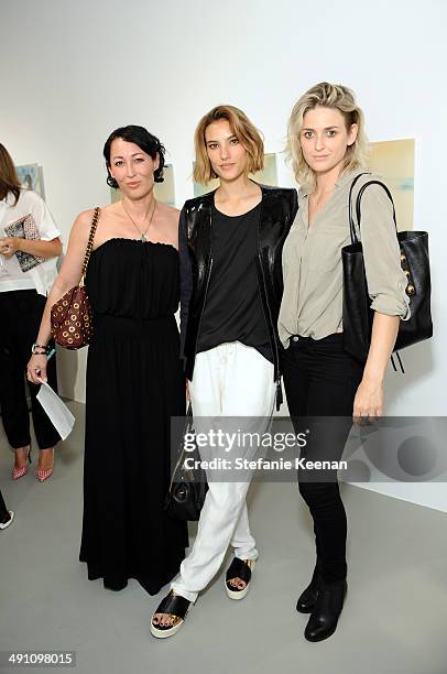 Laura Jonch, Arina Trinneer, and Emily Armstrong attend the grand opening of De Re Gallery on May 15, 2014 in West Hollywood, CA.
