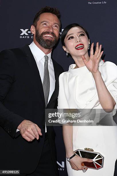 Hugh Jackman and Fan Bingbing wave to fans as they arrive at the Australian premiere of 'X-Men: Days of Future Past" on May 16, 2014 in Melbourne,...