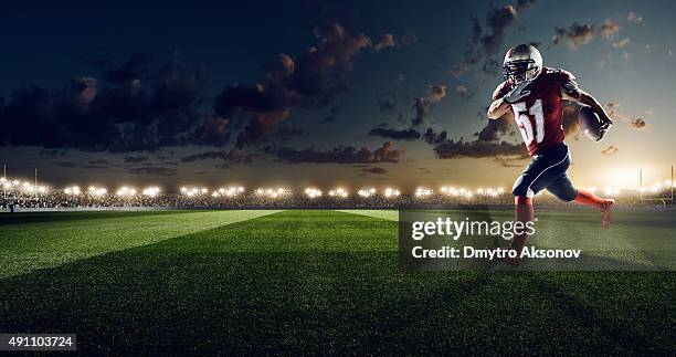 american football in action - football glove stock pictures, royalty-free photos & images