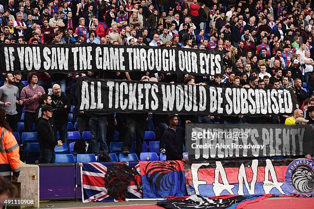 Crystal Palace supporters hold banners to protest against ticket price hike during the Barclays Premier League match between Crystal Palace and West...