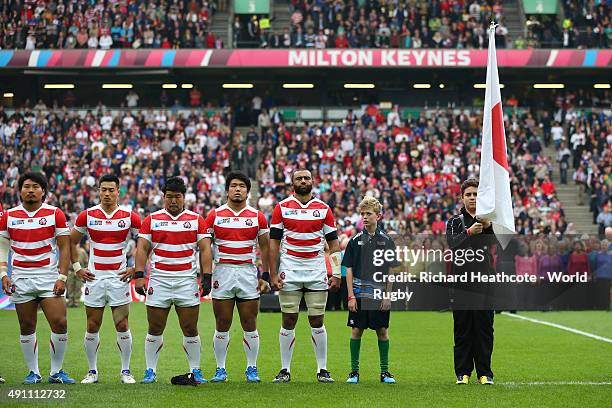 The Japan team line up for the national anthem during the 2015 Rugby World Cup Pool B match between Samoa and Japan at Stadium mk on October 3, 2015...