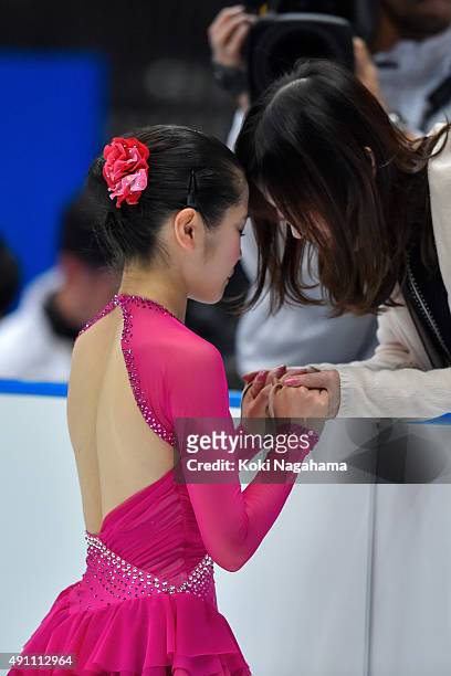 Satoko Miyahara of Japan has a moment with her coach in the Ladies Singles Free Skating during the Japan Open 2015 Figure Skating at Saitama Super...