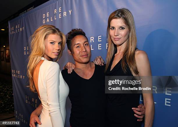 Charlotte Mckinny, John Tew, and Michelle Bof attend the grand opening of De Re Gallery on May 15, 2014 in West Hollywood, CA.