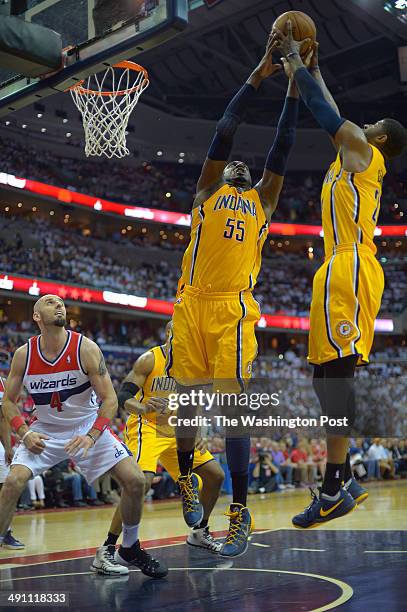 Indiana center Roy Hibbert and Indiana forward Paul George grab a rebound as Washington center Marcin Gortat looks on as the Washington Wizards play...