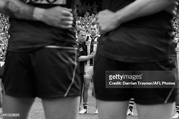 Hawthorn coach Alastair Clarkson and captain Luke Hodge of the Hawks embrace after the national anthem is sung before the 2015 AFL Grand Final match...