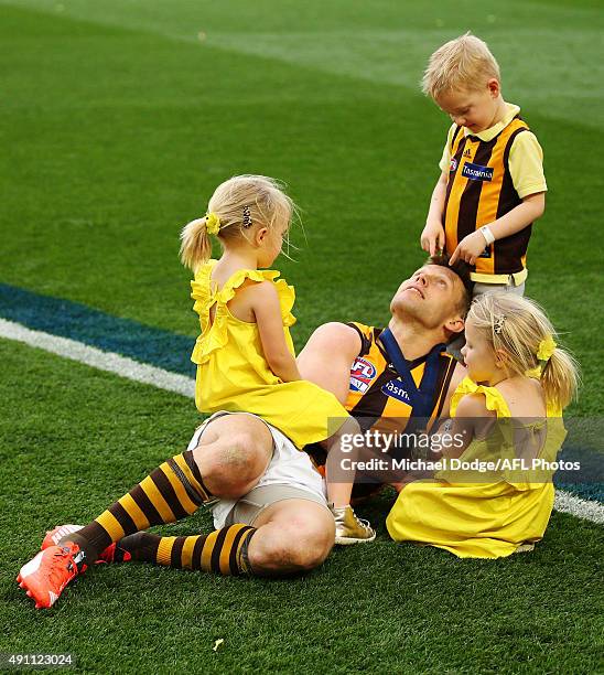 Sam Mitchell of the Hawks celebrates the win with his kids during the 2015 AFL Grand Final match between the Hawthorn Hawks and the West Coast Eagles...