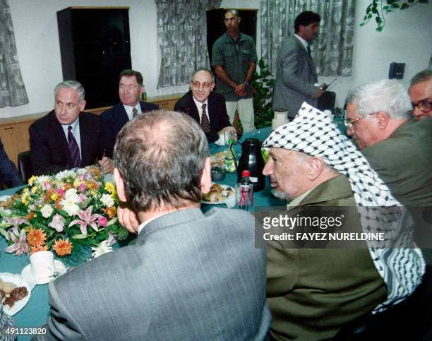 The Israeli delegation headed by Prime Minister Bejamin Netanyahu meets with the Palestinian delegation headed by President Yasser Arafat for the...