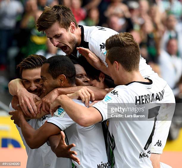 Ibrahima Traore of Moenchengladbach celebrates with Havard Nordtveit and other team mates after scoring his teams second goal during the Bundesliga...