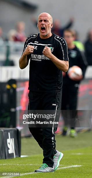 Michael Frontzeck,head coach of Hannover celebrates after the Bundesliga match between Hannover 96 and Werder Bremen at HDI-Arena on October 3, 2015...