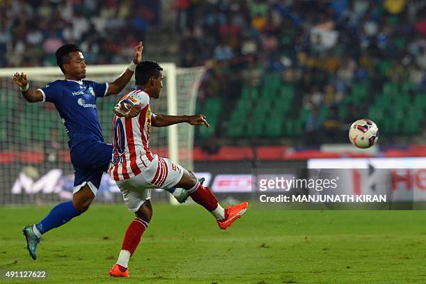Atletico-de-Kolkata player Rino Anto diverts the ball from Chennaiyin FC forward Jeje Lalpekhlua during the Indian Super League football match...