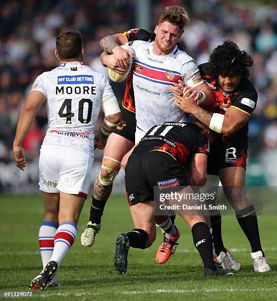 Tom Olbison of Bradford Bulls tackles Anthony Mullally of Wakefield Wildcats during the Million Pound Game between Wakefield Wildcats and Bradford...