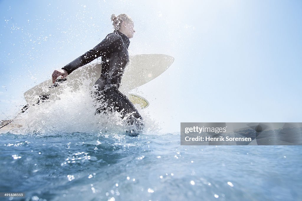 Female surfer on the beach