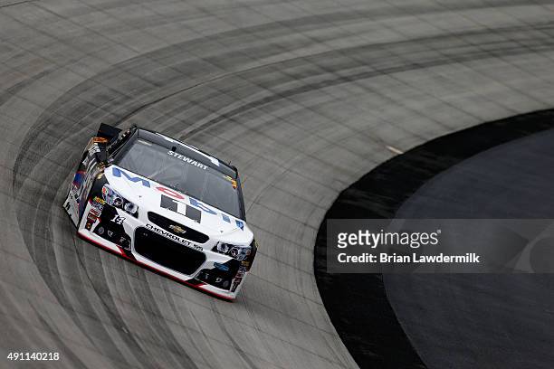 Tony Stewart, driver of the Mobil 1/Bass Pro Shops Chevrolet, drives during practice for the NASCAR Sprint Cup Series AAA 400 at Dover International...