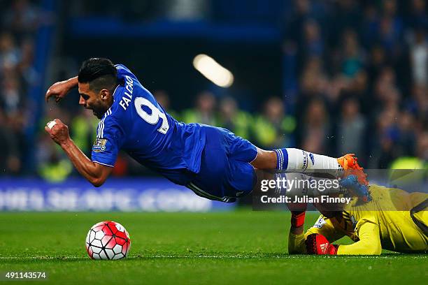 Radamel Falcao Garcia of Chelsea falls resulting in a yellow card for simulation during the Barclays Premier League match between Chelsea and...