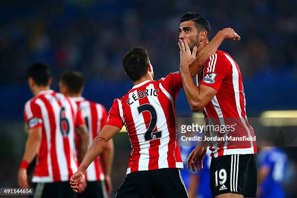 Graziano Pelle of Southampton celebrates scoring his team's third goal with his team mate Cedric Soares during the Barclays Premier League match...