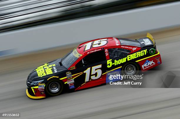 Clint Bowyer, driver of the 5-hour Energy Toyota, drives during practice for the NASCAR Sprint Cup Series AAA 400 at Dover International Speedway on...