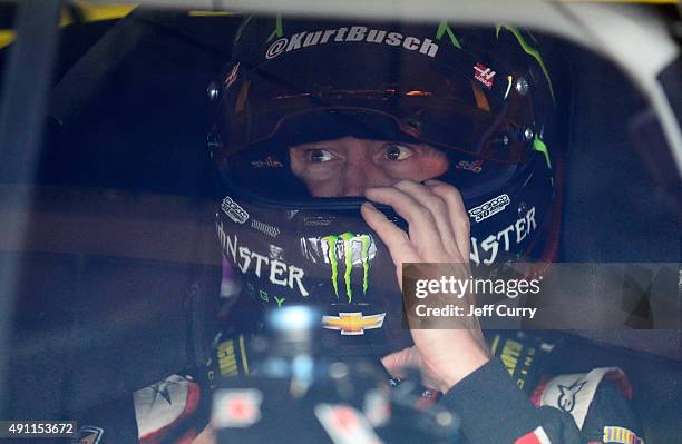 Kurt Busch, driver of the Haas Automation Chevrolet, sits in his car during practice for the NASCAR Sprint Cup Series AAA 400 at Dover International...