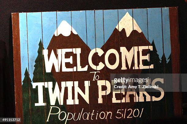 Sign says "Welcome to Twin Peaks Population 51,201 during the sixth annual Twin Peaks UK Festival at Genesis Cinema on October 3, 2015 in London,...