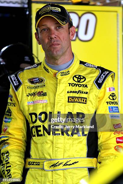 Matt Kenseth, driver of the Dollar General Toyota, looks on in the garage area during practice for the NASCAR Sprint Cup Series AAA 400 at Dover...