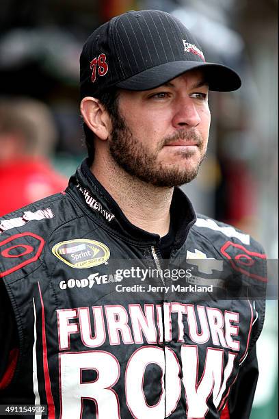 Martin Truex Jr., driver of the Furniture Row/Visser Precision Chevrolet, looks on in the garage area during practice for the NASCAR Sprint Cup...