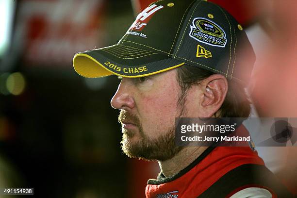 Kurt Busch, driver of the Haas Automation Chevrolet, looks on in the garage area during practice for the NASCAR Sprint Cup Series AAA 400 at Dover...