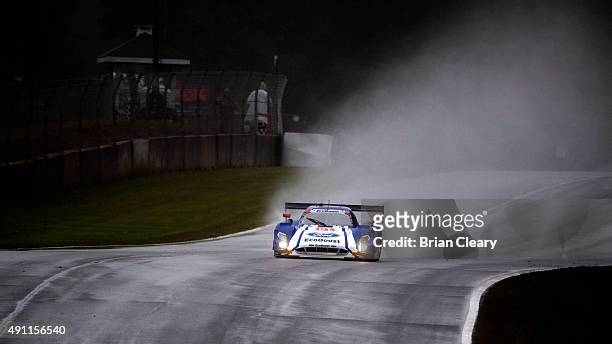 The Rord Riley of Scott Pruett, Joey Hand and Scott Dixon races on the track in the rain during the Petit Le Mans IMSA Tudor Series race at Road...