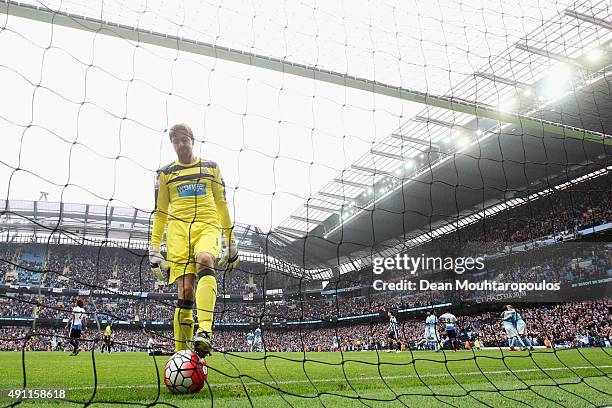 Tim Krul of Newcastle United looks dejected after conceding another goal during the Barclays Premier League match between Manchester City and...