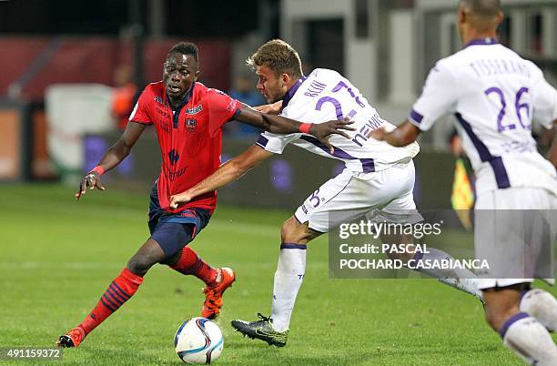 Ajaccio's French forward Kevin Mayi vies with Toulouse's French midfielder Alexis Blin during the French L1 football match GFC Ajaccio against...