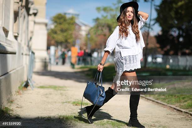 Sofya Benzakour wearing a Dahlia shirt, a Valentino bag and Zara hat, boots and short after the Mugler show during the Paris Fashion Week SS16 on...