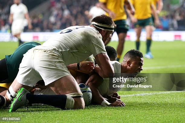 Anthony Watson of England is congratulated by Tom Wood of England after scoring the first England try during the 2015 Rugby World Cup Pool A match...