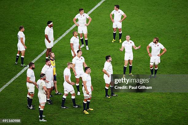 The England team look on dejected during the 2015 Rugby World Cup Pool A match between England and Australia at Twickenham Stadium on October 3, 2015...