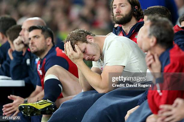 Joe Launchbury of England looks holds his head in his hands on the bench during the 2015 Rugby World Cup Pool A match between England and Australia...