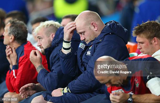 Joe Marler and Dan Cole of England hold their heads in their hands on the replacements bench during the 2015 Rugby World Cup Pool A match between...