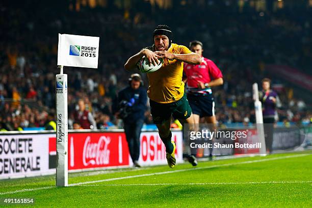 Matt Giteau of Australia goes over to score their third try during the 2015 Rugby World Cup Pool A match between England and Australia at Twickenham...