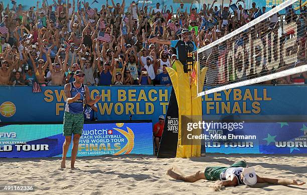 Nick Lucena and Phil Dalhausser of the United States celebrate after winning a match against Alexander Brouwer and Robert Meeuwsen of the Netherlands...