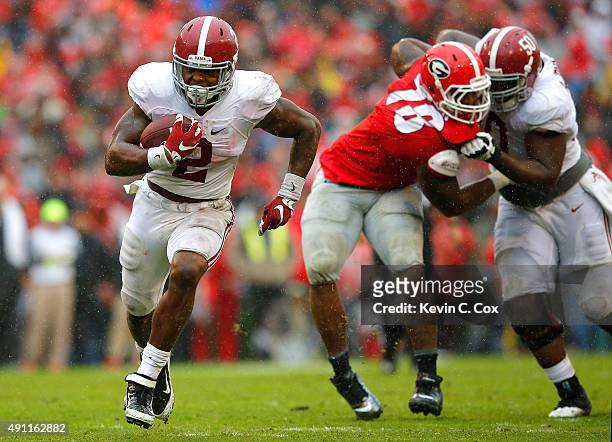 Derrick Henry of the Alabama Crimson Tide rushes for a touchdown against the Georgia Bulldogs at Sanford Stadium on October 3, 2015 in Athens,...