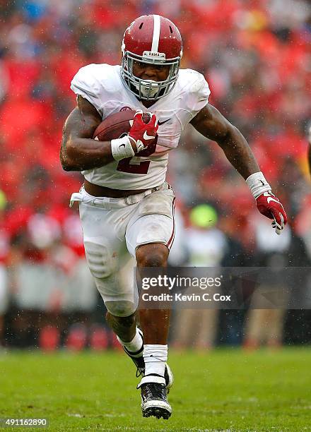 Derrick Henry of the Alabama Crimson Tide rushes for a touchdown against the Georgia Bulldogs at Sanford Stadium on October 3, 2015 in Athens,...