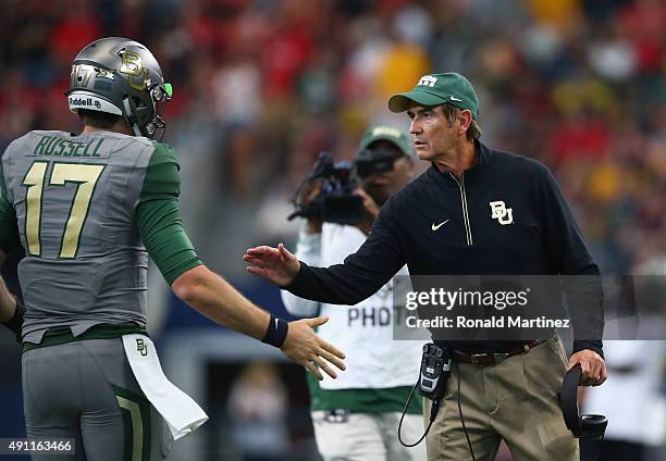 Seth Russell of the Baylor Bears celebrates his touchdown with Art Briles in the second quarter against the Texas Tech Red Raiders at AT&T Stadium on...