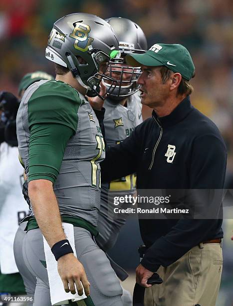 Seth Russell of the Baylor Bears celebrates his touchdown with Art Briles in the second quarter against the Texas Tech Red Raiders at AT&T Stadium on...