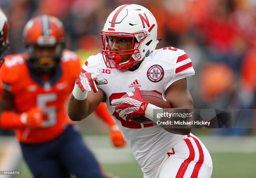 Anthony Ridder of the Nebraska Cornhuskers runs the ball as James ...