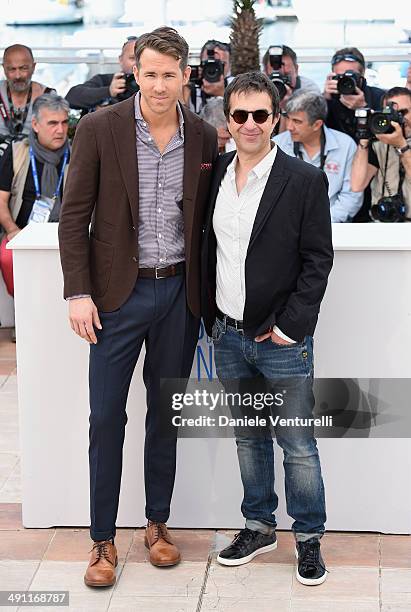 Actor Ryan Reynolds and director Atom Egoyan attend "Captives" photocall at the 67th Annual Cannes Film Festival on May 16, 2014 in Cannes, France.